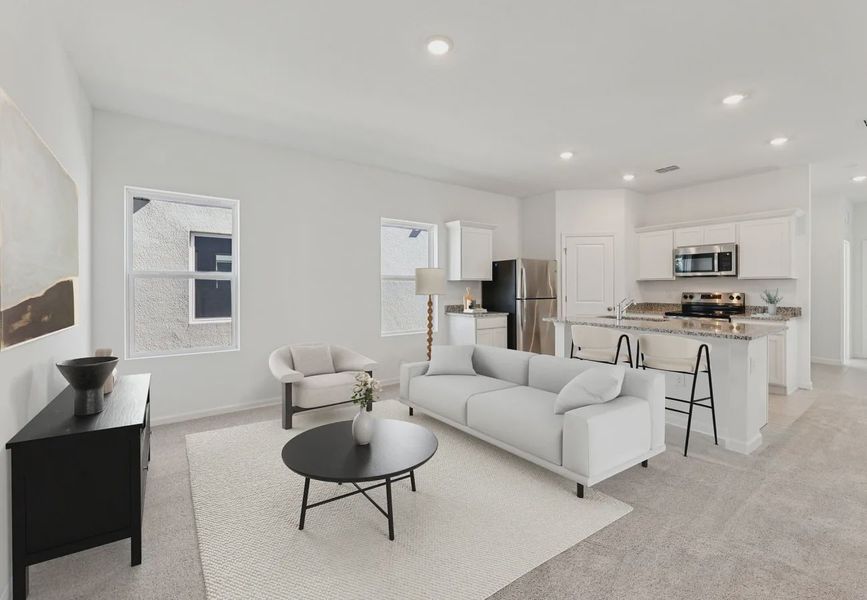 Furnished interior in a model home at Hawks Run in Kissimmee (Image 7).