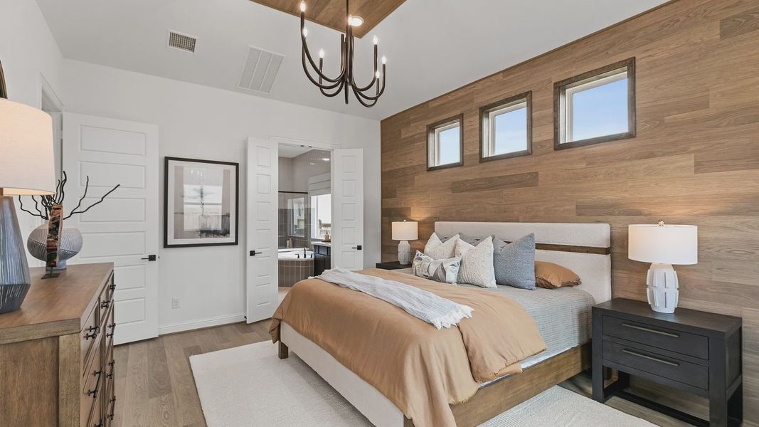 Sophisticated wood paneling and chic chandelier enrich this opulent Beamer Villas bedroom. Sophisticated wood paneling and chic chandelier enrich this opulent Beamer Villas bedroom.