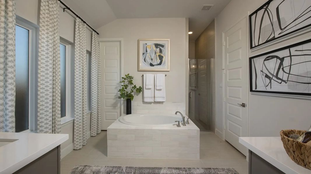 Furnished interior in a model home at Lakes Of Cane Island 55' in Katy (Image 10).