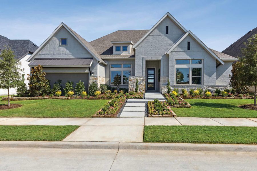 Front exterior of a home in the Northshore at Lakewood Village - Garden Series community, located in Lakewood Village, TX (Image 2). Front exterior of a home in the Northshore at Lakewood Village - Garden Series community, located in Lakewood Village, TX (Image 2).