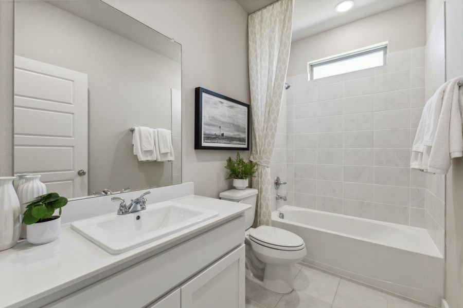 REPRESENTATIVE PHOTO – Bathroom in a Stratton Place new home in Greenville TX by Trophy Signature Homes