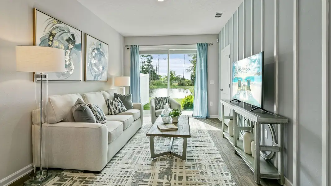 Furnished interior in a model home at Stokes Landing Express in St. Augustine (Image 10).