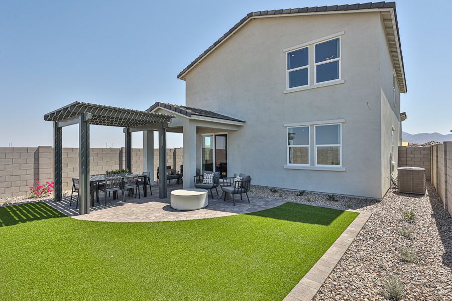 A house with a patio and tables.
