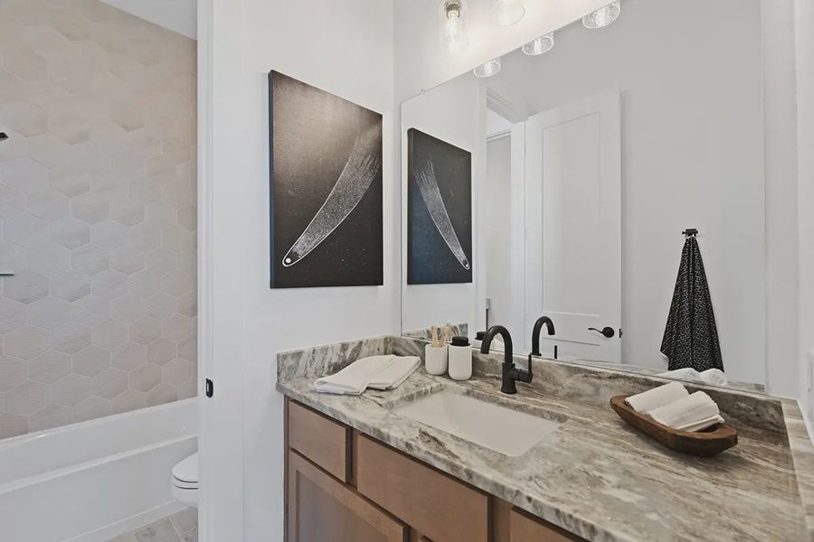 Furnished interior in a model home at Brookewater 60's in Rosenberg (Image 32).