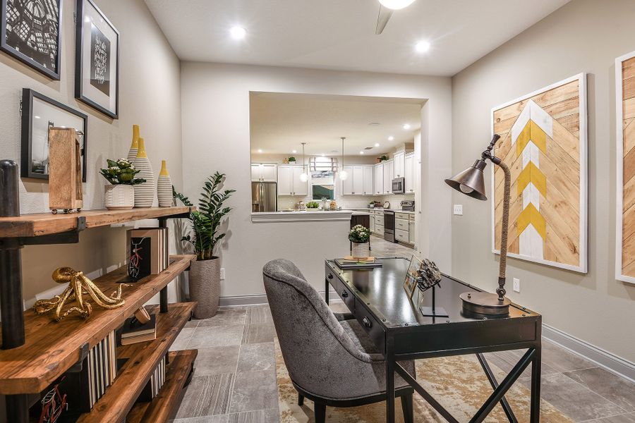 Furnished interior in a model home at John's Lake Landing - Cottage Series in Clermont (Image 5).