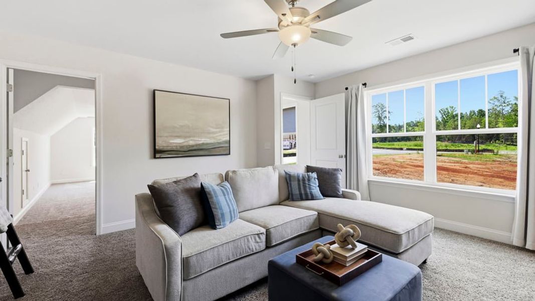 Furnished interior in a model home at Arrowood Acres in Enoree (Image 28).