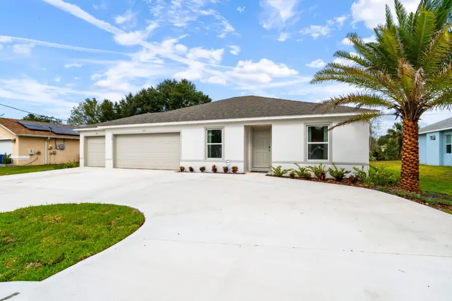 Front exterior of a home in the Palm Coast community, located in Palm Coast, FL (Image 2).