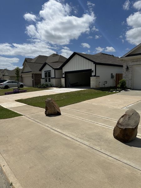 A charming modern home with a spacious driveway in Willow Trace 45' by Century Communities (Spring, TX).