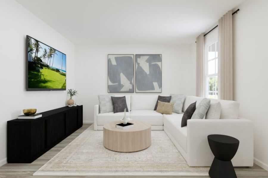 A living room with a white couch and a coffee table. A living room with a white couch and a coffee table.