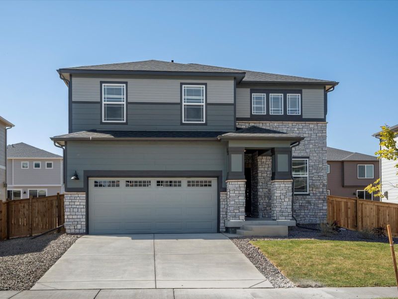 Front exterior of a home in the Buffalo Highlands: The Flora Collection community, located in Commerce City, CO (Image 9).