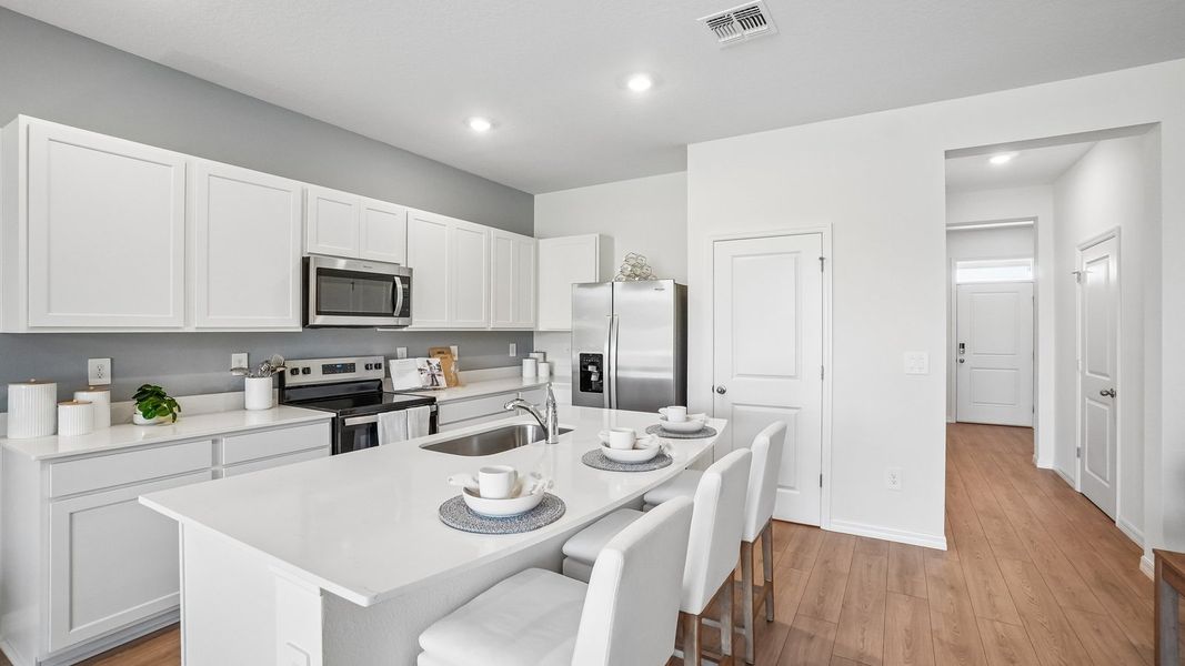 Furnished interior in a model home at Sanctuary at Citrus Park Townhomes in Tampa (Image 6).