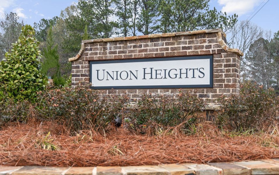 A sign on a brick building. A sign on a brick building.