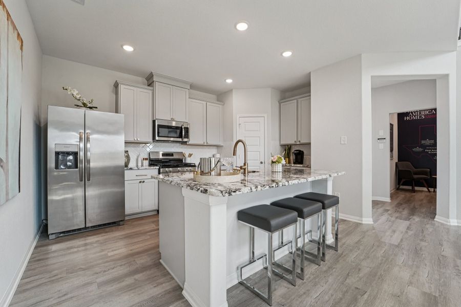 Furnished interior in a model home at Bluestem in Brookshire (Image 7).