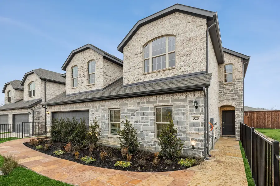 Front exterior of a home in the Main Street Village community, located in Mansfield, TX (Image 1). Front exterior of a home in the Main Street Village community, located in Mansfield, TX (Image 1).