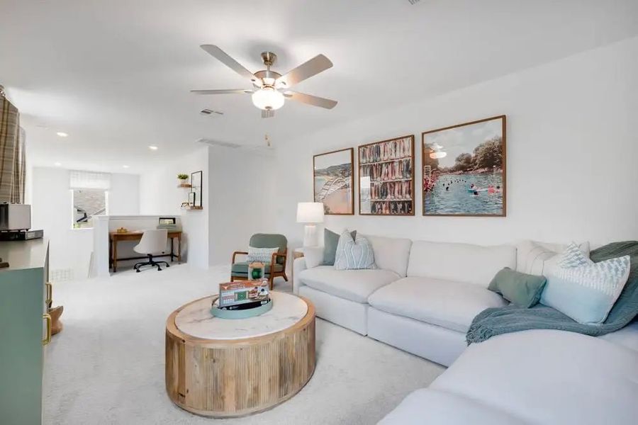 Furnished interior in a model home at Village Grove in Dripping Springs (Image 6).