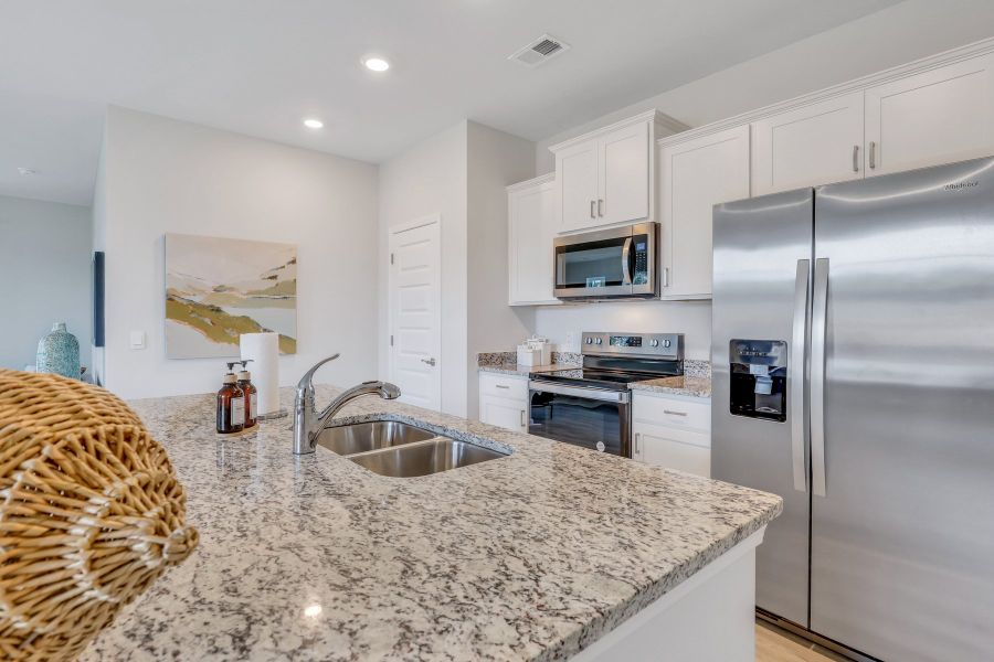Furnished interior in a model home at Westbrook Retreat Villas at Savannah Quarters in Pooler (Image 15).