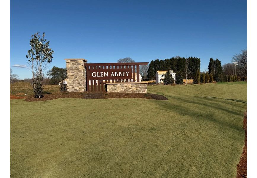 Entrance to the Glen Abbey community in Kernersville, NC, featuring signage and landscaping (Image 1). Entrance to the Glen Abbey community in Kernersville, NC, featuring signage and landscaping (Image 1).