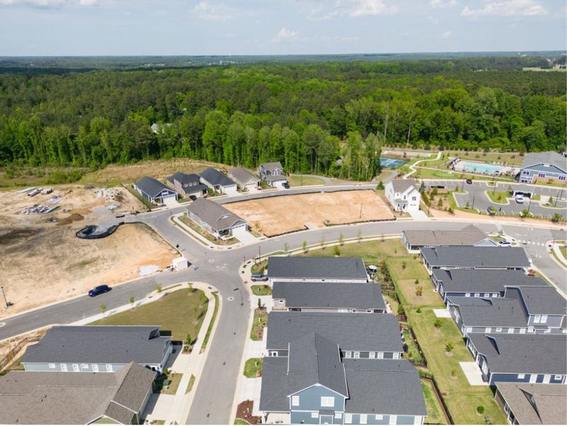 Aerial view of the The Walk at East Village community in Clayton, NC, showing layout and nearby surroundings (Image 13). Aerial view of the The Walk at East Village community in Clayton, NC, showing layout and nearby surroundings (Image 13).