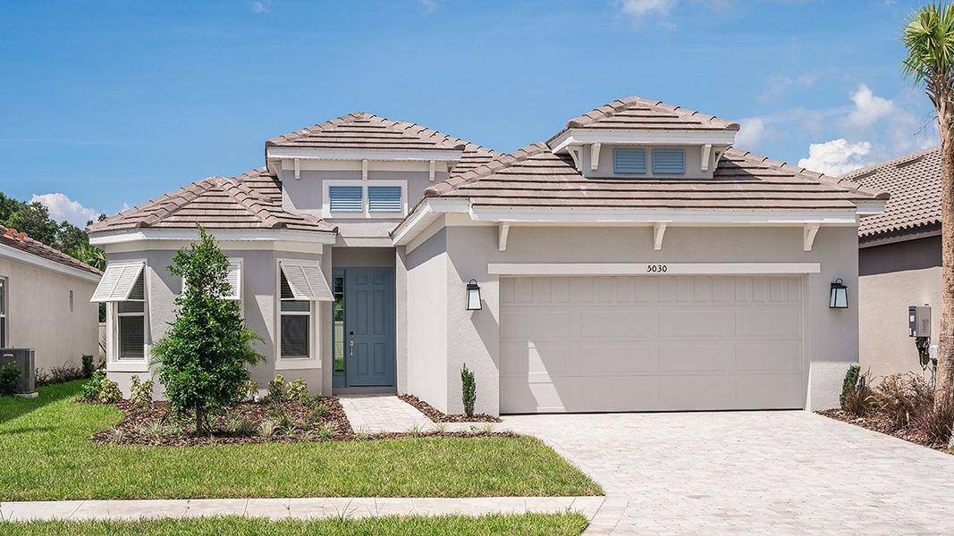 Front exterior of a home in the Esplanade Lake Club community, located in Fort Myers, FL (Image 5).