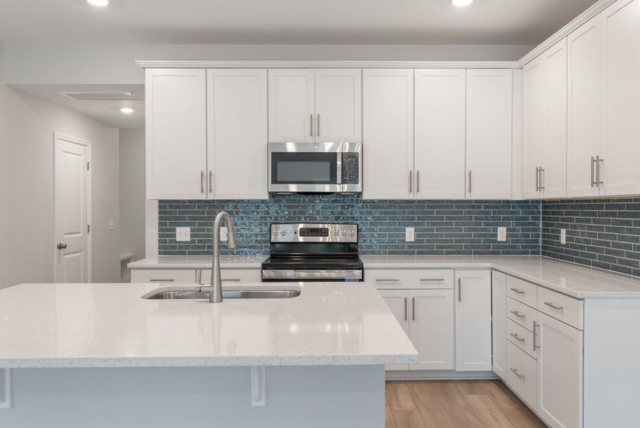 Furnished interior in a model home at 1158 Place Townhomes in Wilson (Image 5). Furnished interior in a model home at 1158 Place Townhomes in Wilson (Image 5).