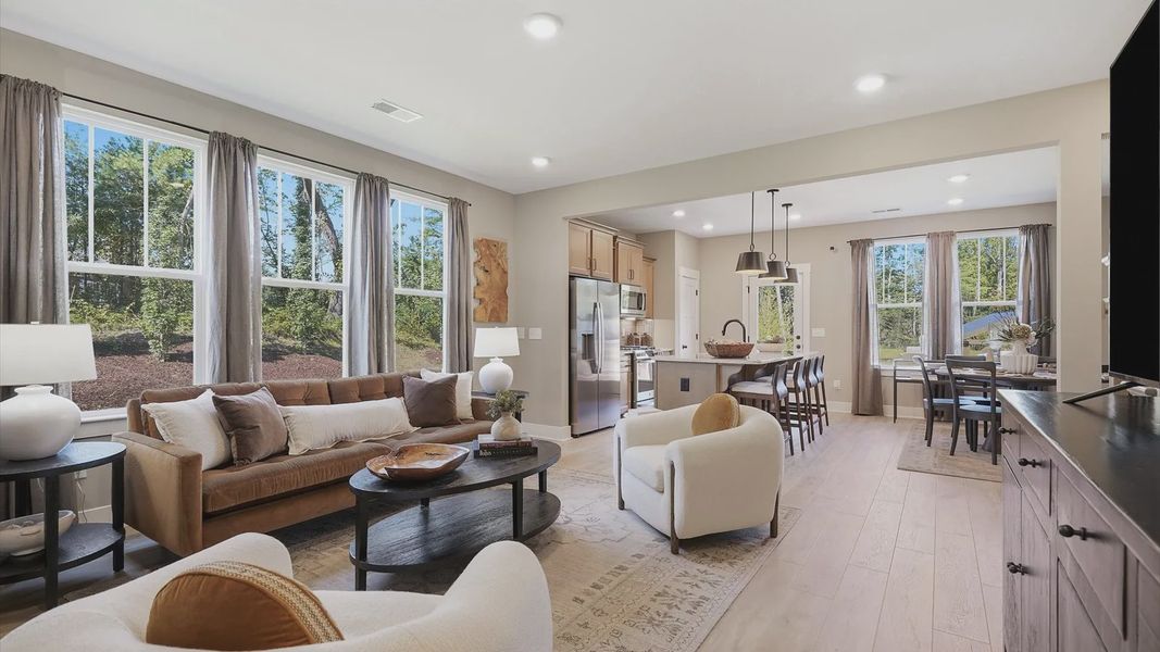 Hardwood flooring and high standards define this vibrant family room ideal for everyday living at Brookland Place