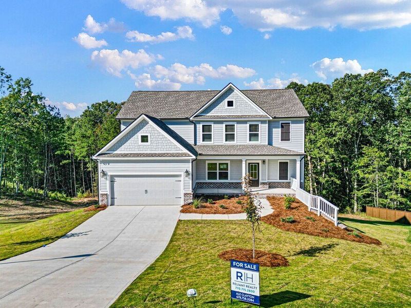Front exterior of a home in the Woodland Hills community, located in Loganville, GA (Image 4).