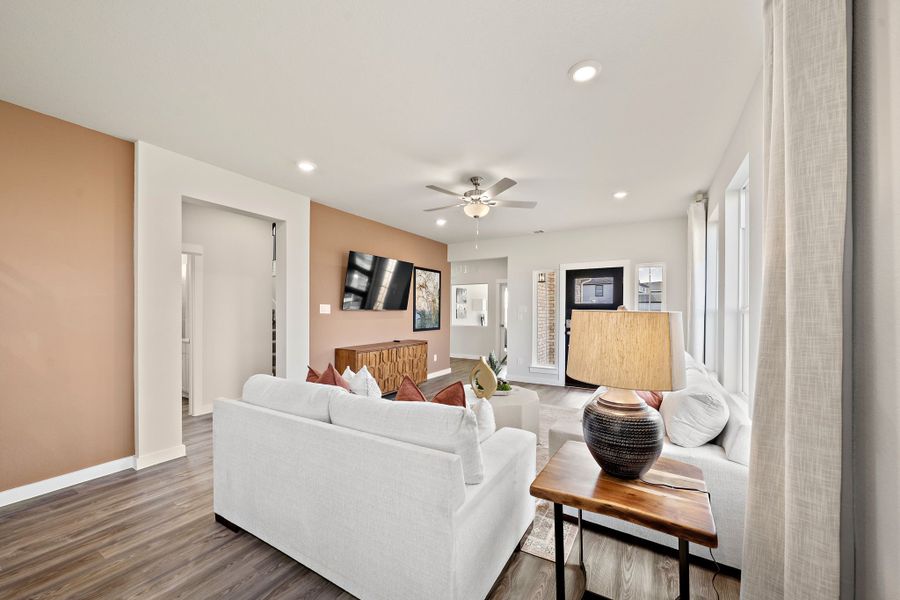 A living room with a white couch.