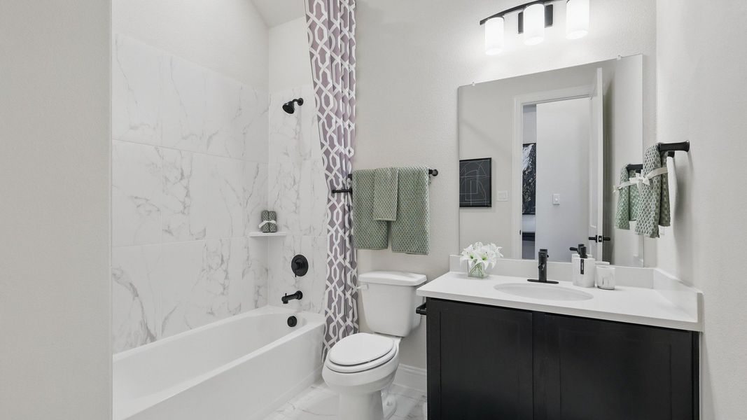 Furnished interior in a model home at Westridge Premier in San Antonio (Image 12).