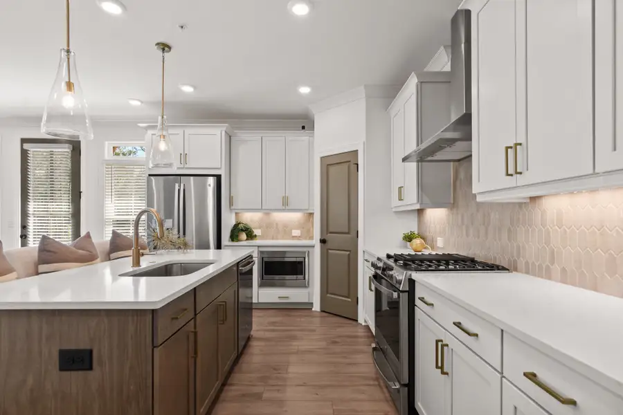 Furnished interior in a model home at Waterhaven Townhomes in Cumming (Image 6).