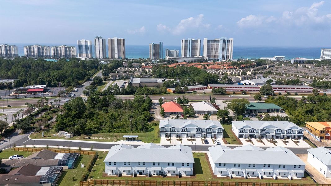 Aerial view of the Caballeros Estates At Hombre community in Panama City Beach, FL, showing layout and nearby surroundings (Image 1).