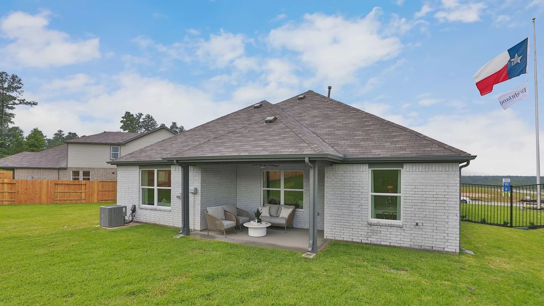 Sophisticated brick exterior with a stylish patio in serene Mostyn Springs, Texas. Sophisticated brick exterior with a stylish patio in serene Mostyn Springs, Texas.