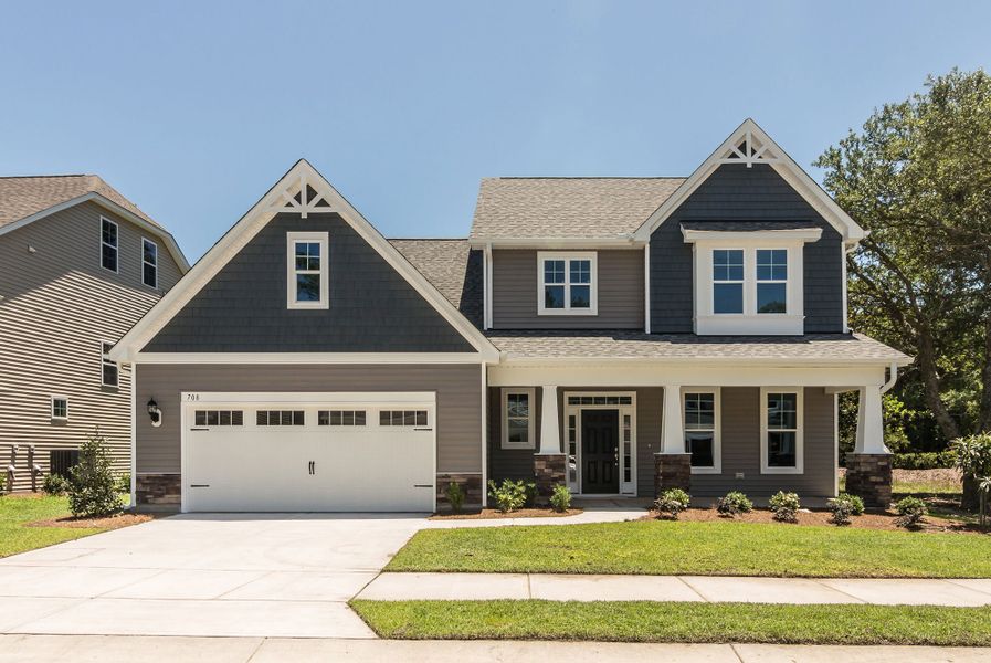 Front exterior of a home in the Melton Oaks - Robuck Homes community, located in Garner, NC (Image 8). Front exterior of a home in the Melton Oaks - Robuck Homes community, located in Garner, NC (Image 8).