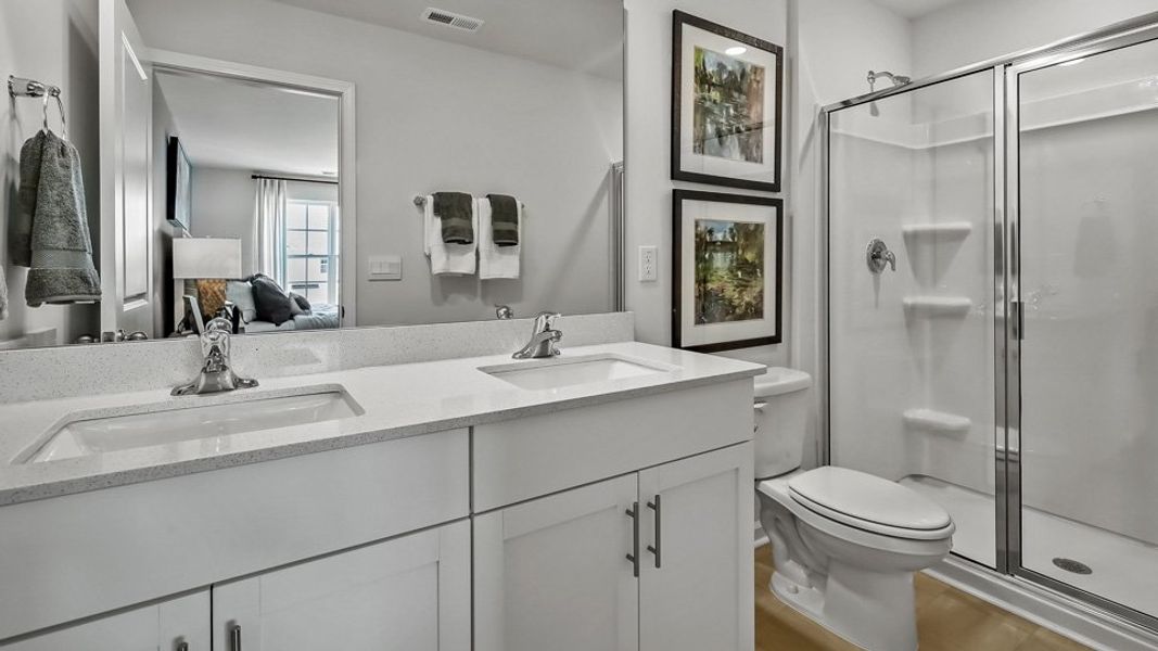 Furnished interior in a model home at The Townes at Prestleigh in Wake Forest (Image 27).