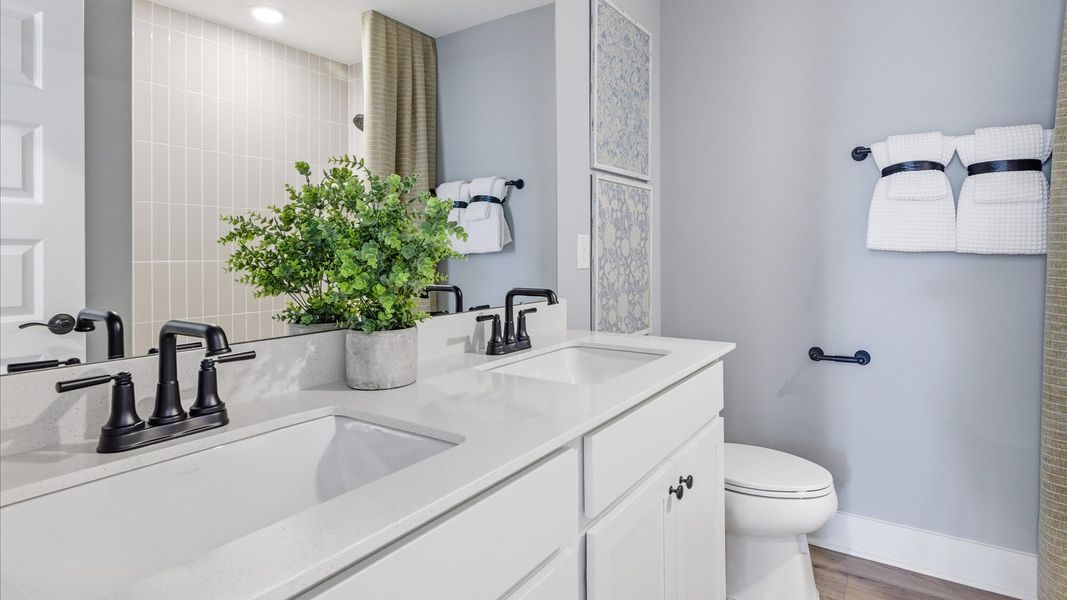 Furnished interior in a model home at Weavers Pointe in Zebulon (Image 20).