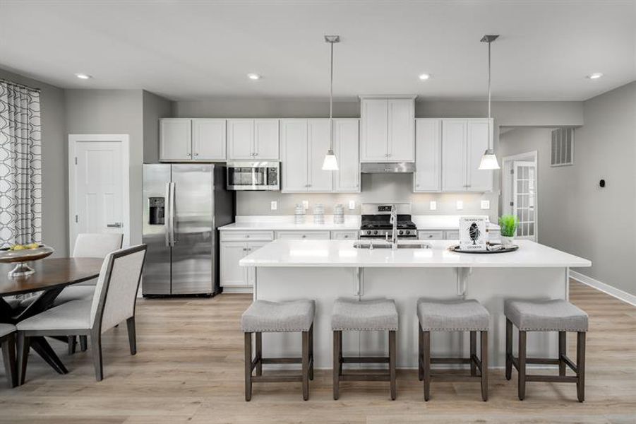 Furnished interior in a model home at Derby Meadows in Pleasant View (Image 5).