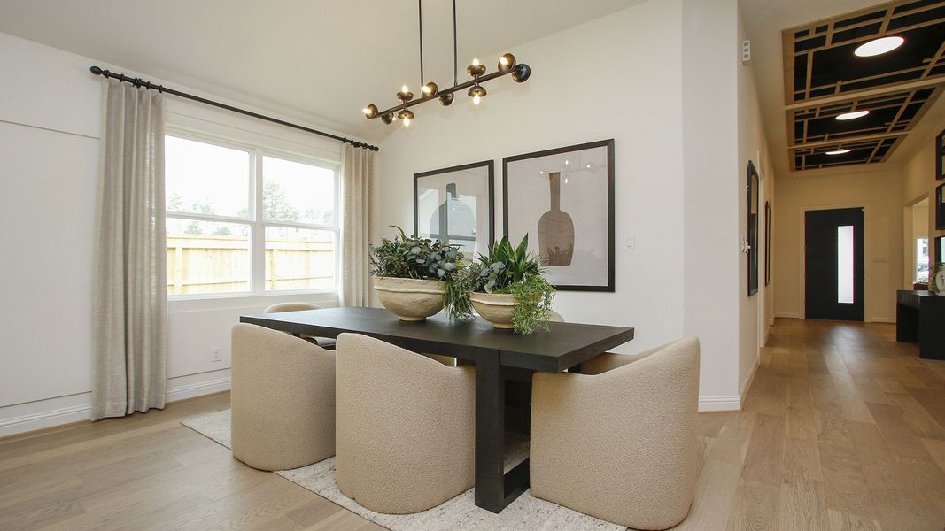 Experience the exquisite design with plush seating, sleek fixtures, and natural light in The Woodlands Hills.