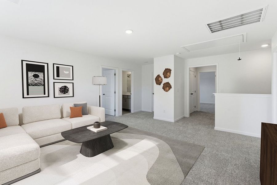A living room with a couch and a coffee table.