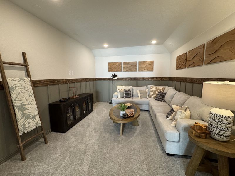 A cozy living room with a plush sectional, modern art, and wood accents, perfect for relaxation and entertainment. A cozy living room with a plush sectional, modern art, and wood accents, perfect for relaxation and entertainment.