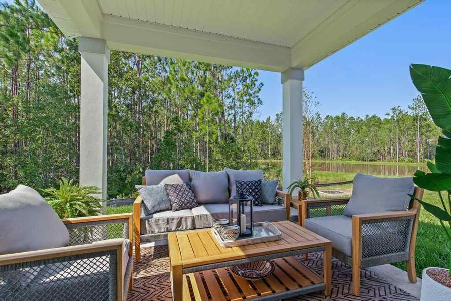A living room with a covered patio. A living room with a covered patio.