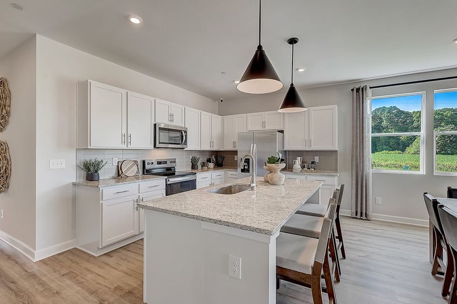 A kitchen with white cabinets. A kitchen with white cabinets.