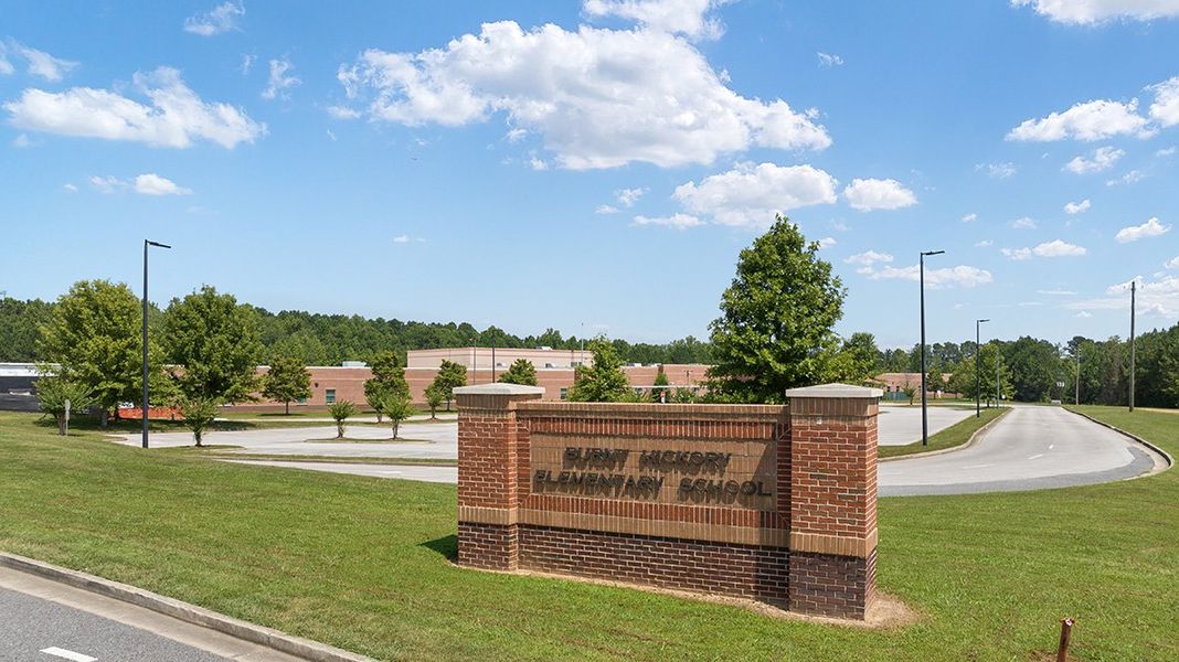 Entrance to the Lost Creek community in Dallas, GA, featuring signage and landscaping (Image 1). Entrance to the Lost Creek community in Dallas, GA, featuring signage and landscaping (Image 1).