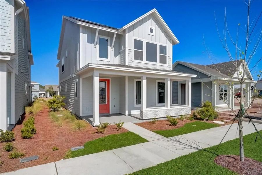 Street view of homes within the Sunbridge master-planned community in St. Cloud, FL (Image 17).