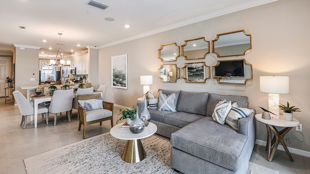 Furnished interior in a model home at Esplanade Lake Club Condos in Fort Myers (Image 46).