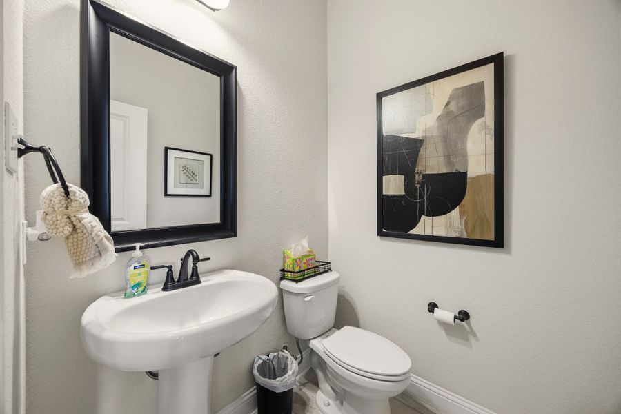 Furnished interior in a model home at Abe's Landing in Granbury (Image 24).