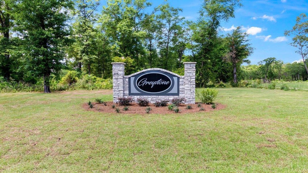 Entrance to the Greystone community in Crawfordville, FL, featuring signage and landscaping (Image 1).