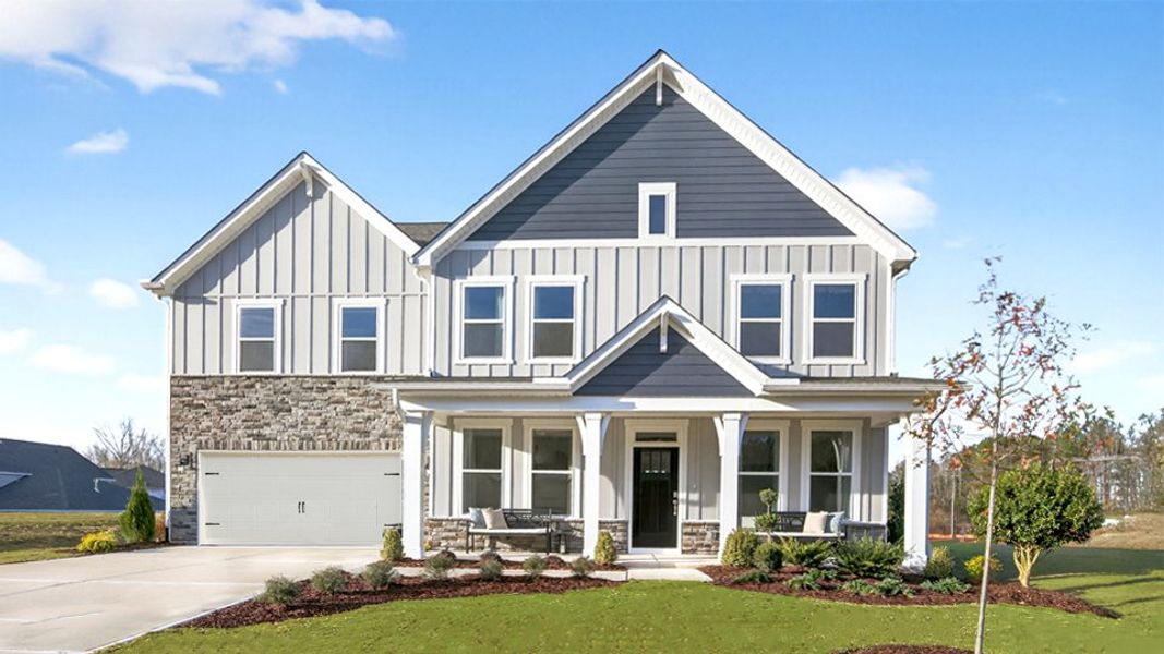 Front exterior of a home in the The Grove at Winston Pointe community, located in Clayton, NC (Image 1). Front exterior of a home in the The Grove at Winston Pointe community, located in Clayton, NC (Image 1).