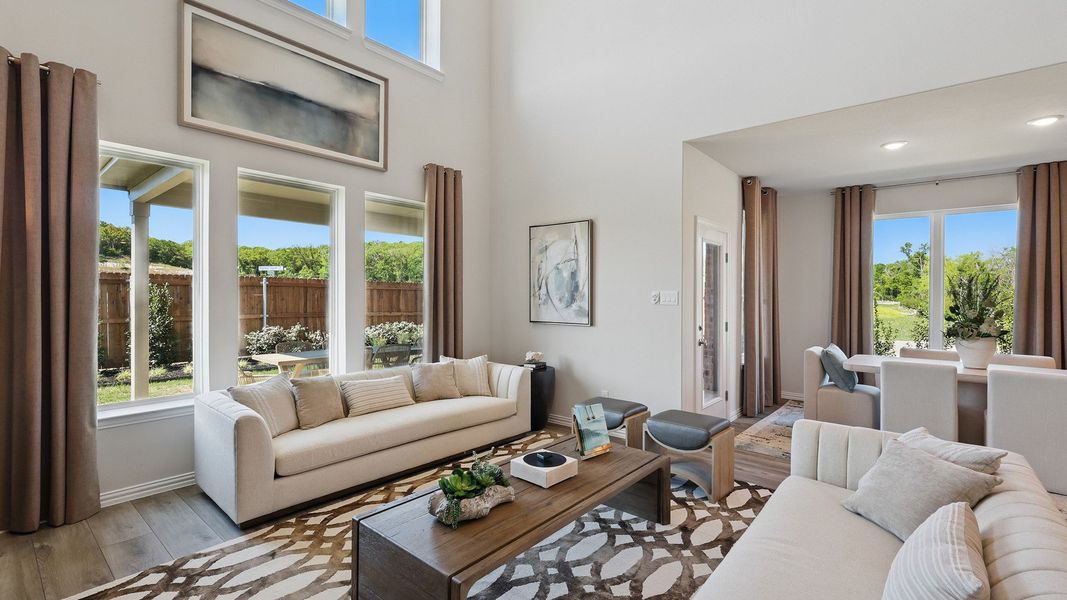 Experience elegance with high ceilings and abundant natural light in Green Oaks Preserve's refined interiors. Experience elegance with high ceilings and abundant natural light in Green Oaks Preserve's refined interiors.