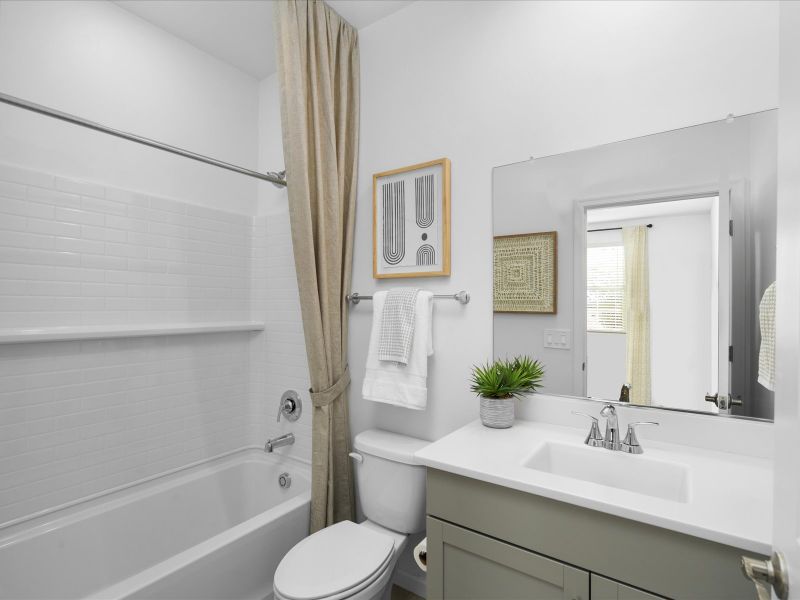 The bathroom located in bedroom 4 makes the room an ideal guest suite or office in the 2110 plan.