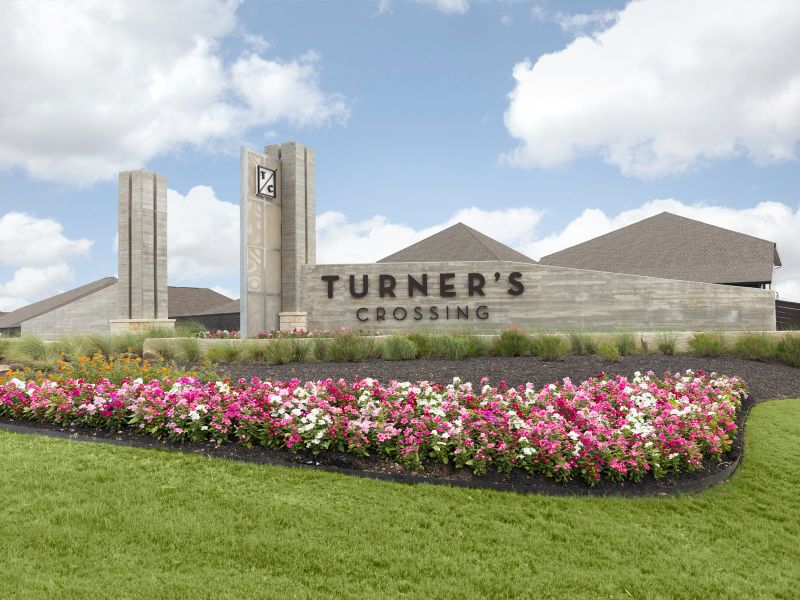 Entrance to the Turner's Crossing - Reserve Collection community in Buda, TX, featuring signage and landscaping (Image 2). Entrance to the Turner's Crossing - Reserve Collection community in Buda, TX, featuring signage and landscaping (Image 2).
