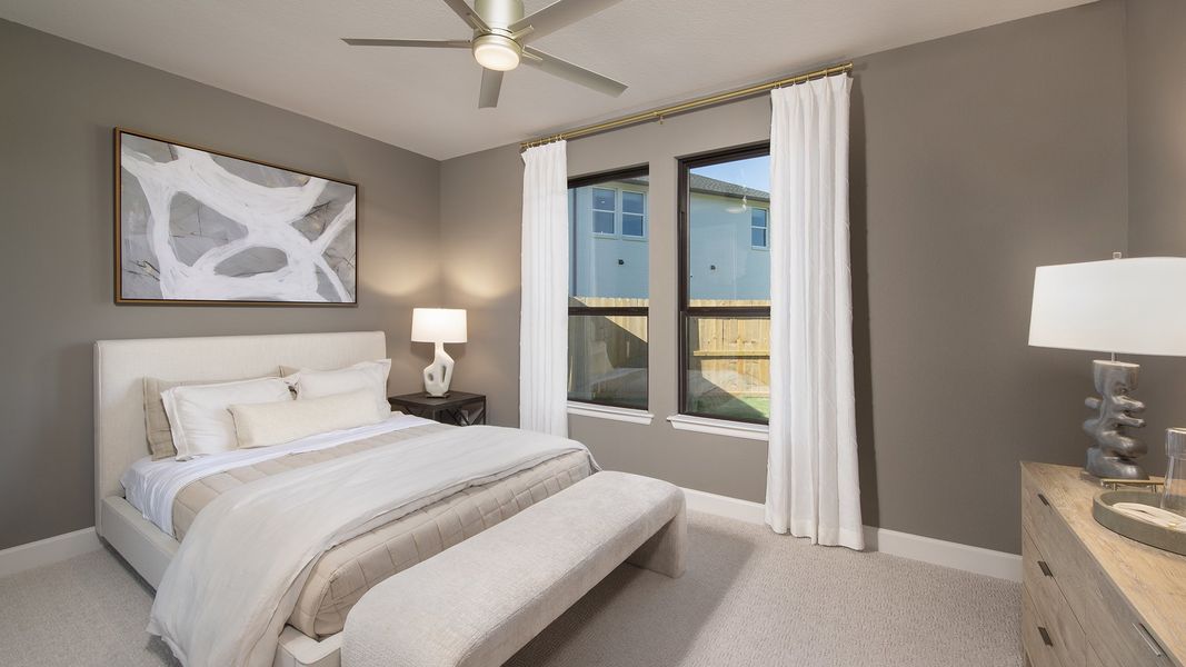 Furnished interior in a model home at Cross Creek West 55' in Fulshear (Image 21).